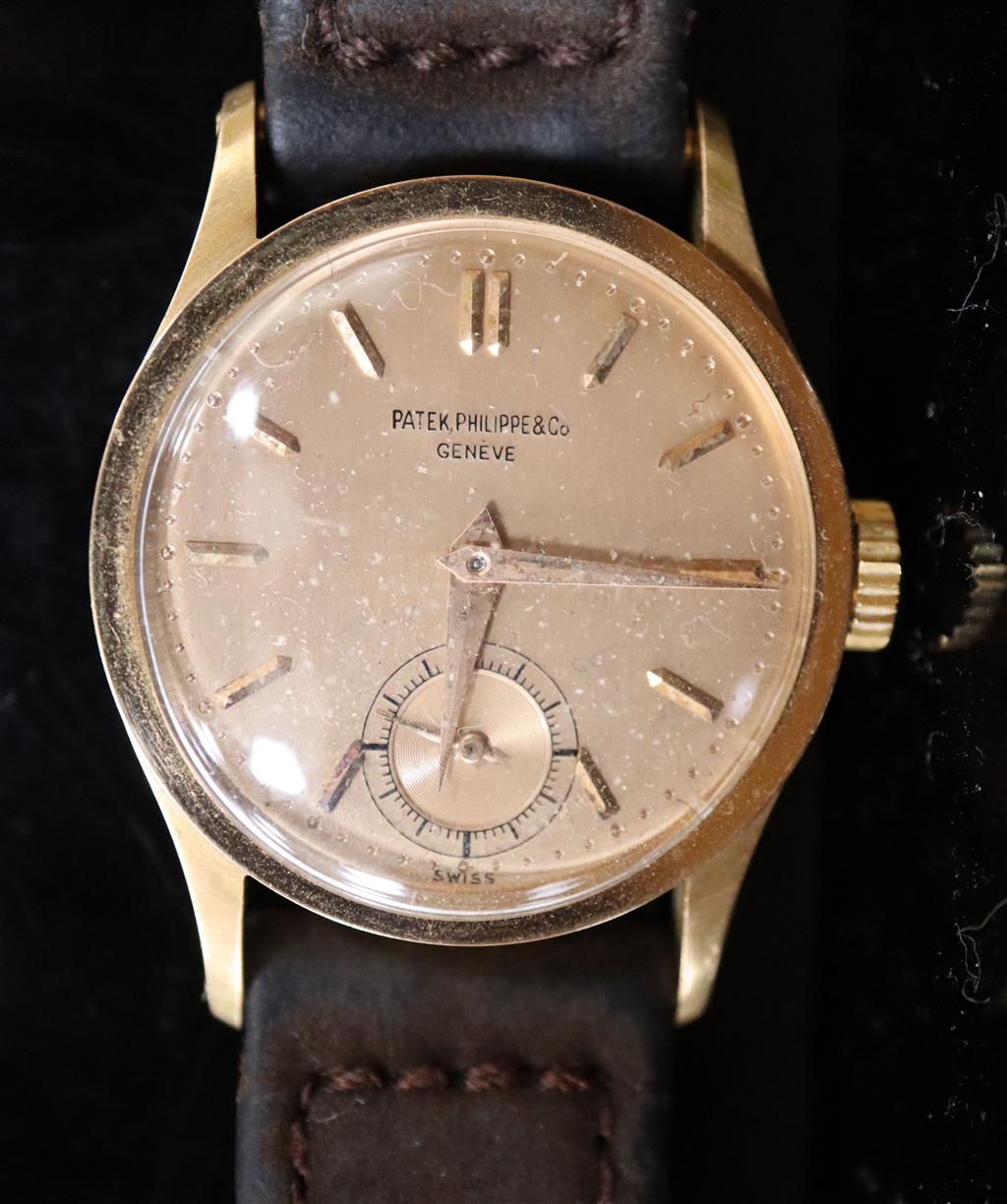 A gentlemans 18k gold Patek Philippe & Co manual wind wrist watch,